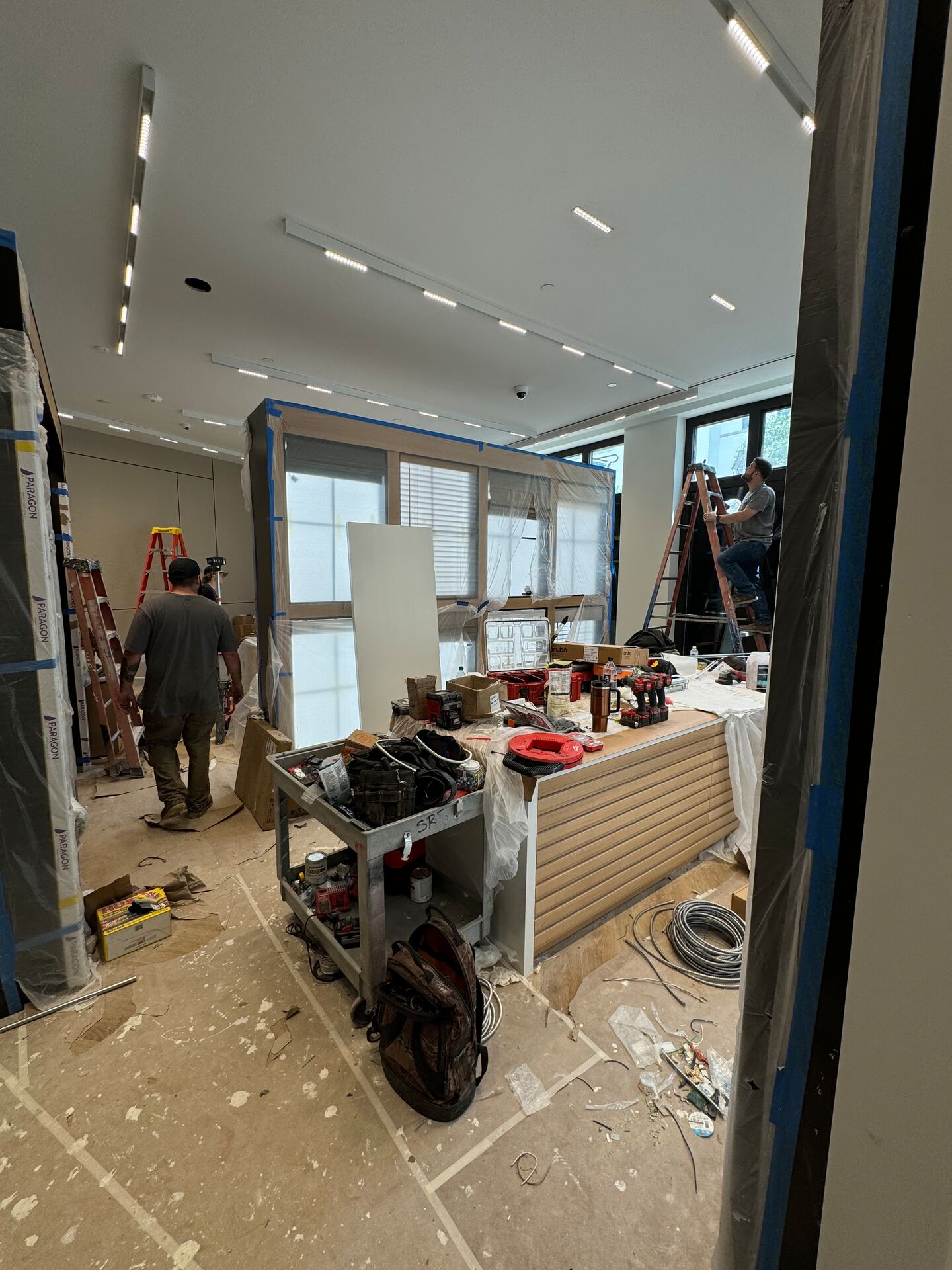 Retail store construction management — active buildout with trade oversight